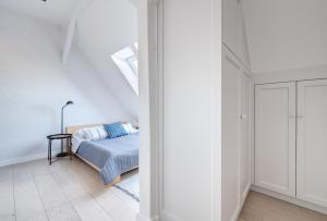 Postel nebo postele na pokoji v ubytování DR Apartments - Loft 2