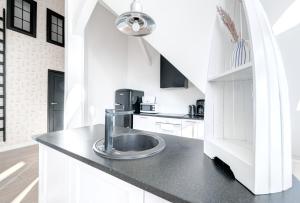 Kuchyň nebo kuchyňský kout v ubytování DR Apartments - Loft 2