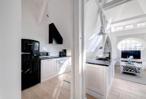 Kuchyň nebo kuchyňský kout v ubytování DR Apartments - Loft 2