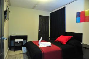 Televízia a/alebo spoločenská miestnosť v ubytovaní G y V Hotels