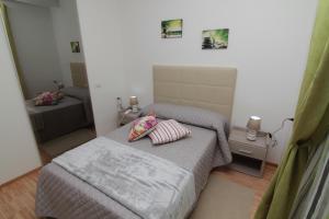 Postel nebo postele na pokoji v ubytování Al Bastione Relais Suite & Rooms