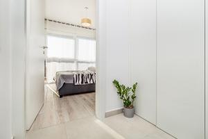 Postel nebo postele na pokoji v ubytování Apartments Solis Lacus Penthouse