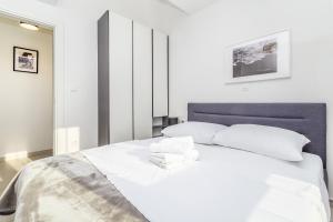 Postel nebo postele na pokoji v ubytování Apartments Solis Lacus Penthouse