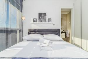 Postel nebo postele na pokoji v ubytování Apartments Solis Lacus Penthouse