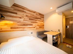 Ένα ή περισσότερα κρεβάτια σε δωμάτιο στο Super Hotel Shinbashi-Karasumoriguchi +20 φωτογραφίες