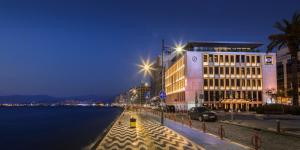 a large building with a clock on the side of it at Key Hotel in İzmir