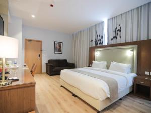 Voodi või voodid majutusasutuse La Locanda Boutique Hotel toas