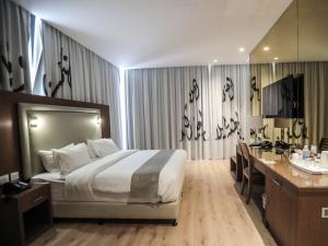 Voodi või voodid majutusasutuse La Locanda Boutique Hotel toas