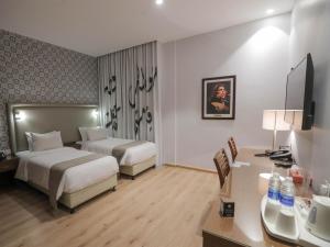 Voodi või voodid majutusasutuse La Locanda Boutique Hotel toas