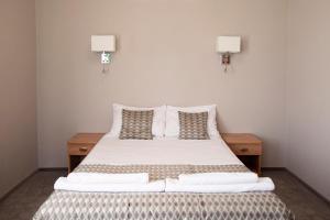 Postel nebo postele na pokoji v ubytování Hotel Jan Sander