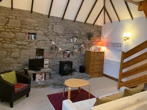 A seating area at Smiddy Barn Apartment 