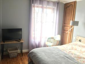 Postel nebo postele na pokoji v ubytování SUITE FAMILIALE DU BOURGEAU
