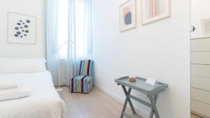 Łóżko lub łóżka w pokoju w obiekcie Italianway - Garigliano 8