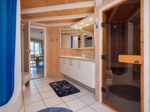 a bathroom with a sink and a toilet in a room at Luxury Oasis in Pot Strandby-By Traum in Tjørneholm +41 photos
