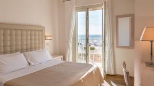 Postel nebo postele na pokoji v ubytování Hotel Alta La Vista
