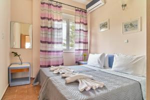 Postel nebo postele na pokoji v ubytování Villa Elia