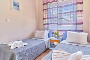 Postel nebo postele na pokoji v ubytování Villa Elia
