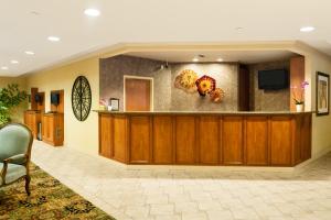 a lobby of a hospital with a reception desk at The Mediterranean Inn in Seattle