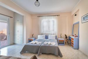 Postel nebo postele na pokoji v ubytování Villa Elia + 37 fotografií