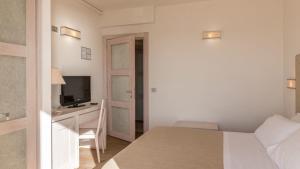 Postel nebo postele na pokoji v ubytování Hotel Alta La Vista