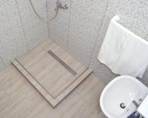 Ванная комната в Hotel Road Rooms