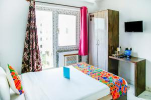 Postel nebo postele na pokoji v ubytování FabHotel Eleanora - New Town
