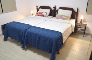 Ένα ή περισσότερα κρεβάτια σε δωμάτιο στο Hotel Road Rooms