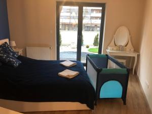 Posteľ alebo postele v izbe v ubytovaní Wislane Tarasy 2.0 by Atrium Apartments