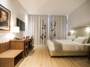 Voodi või voodid majutusasutuse La Locanda Boutique Hotel toas