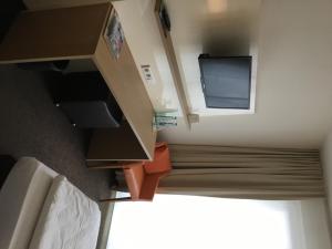 TV a/nebo společenská místnost v ubytování Ardey Hotel