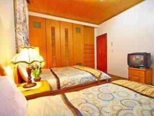 Cama o camas de una habitación en Yilan Affectivity