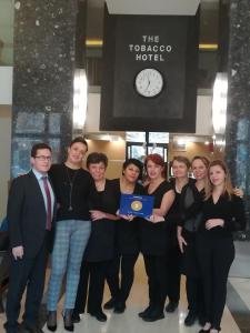 a group of people posing for a picture in front of a hotel at Davitel - Tobacco Hotel in Thessaloniki