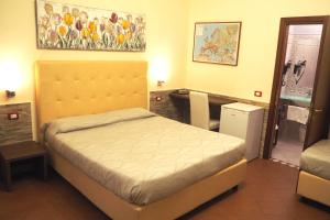 Postel nebo postele na pokoji v ubytování Hotel Ester