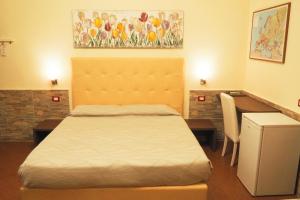 Postel nebo postele na pokoji v ubytování Hotel Ester