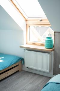 En eller flere senge i et værelse på Bieszczadzki Hals - Dom bliźniak + 21 billeder