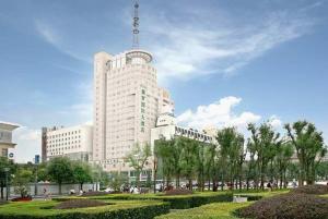 a large white building with a train on it at Aurum International Hotel Xi'an in Xi'an