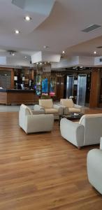 
a living room filled with furniture and appliances at Primacy Apart Hotel in Mar del Plata

