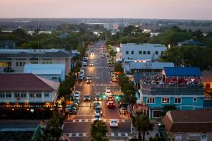 a city street filled with lots of traffic at Tides Folly Beach in Folly Beach