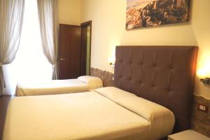 Postel nebo postele na pokoji v ubytování Hotel Ester
