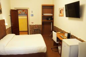 TV a/nebo společenská místnost v ubytování Hotel Ester