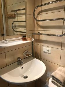 a bathroom with a sink and a mirror at Ošupynė in Šventoji +42 photos