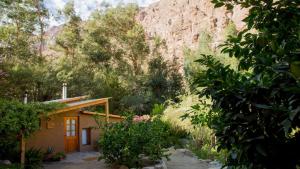 a small house in the middle of a mountain at Cabañas El Albaricoque Cochiguaz in El Sanjeado