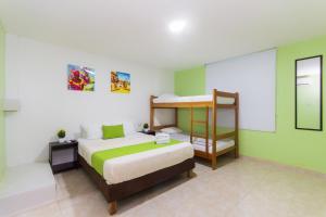 Postel nebo postele na pokoji v ubytování Hotel Avexi Suites By GEH Suites