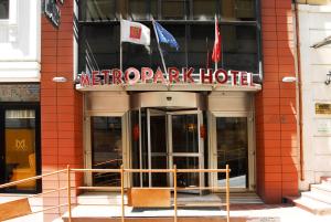 a sign for a hotel on the side of a building at Taksim Metropark Hotel in Istanbul