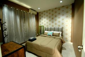 Giường trong phòng chung tại Little home poolvilla