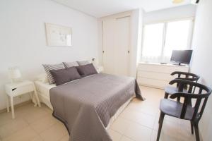 Postel nebo postele na pokoji v ubytování Precioso Apartamento con wifi y A/C + 10 fotografií