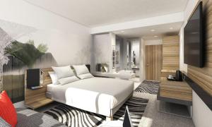 1 dormitorio con 1 cama blanca y TV en Novotel London Waterloo, en Londres