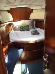 a small bed in the back of a boat at LUXURY YACHT STAY "White Dove" sleeps 6 in Gibraltar