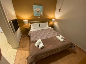 Harmony Athens Residenceにあるベッド