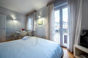Televiisor ja/või meelelahutuskeskus majutusasutuses Ripetta 25 Prestige Rooms
